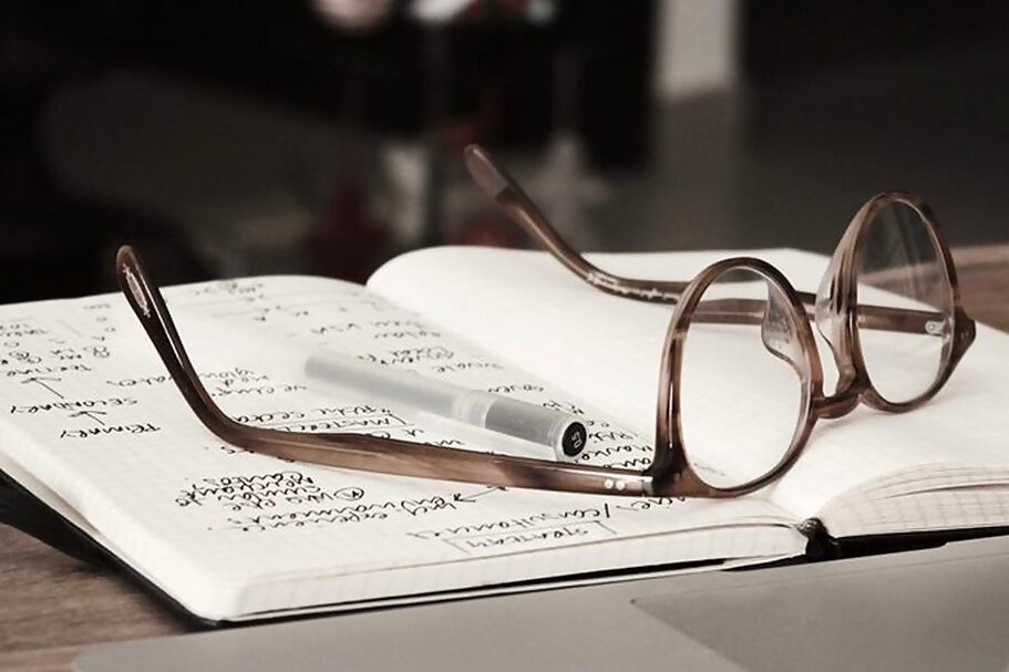 Pair of glasses on a book